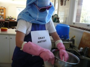 OKAY ARTIST washing her dishes